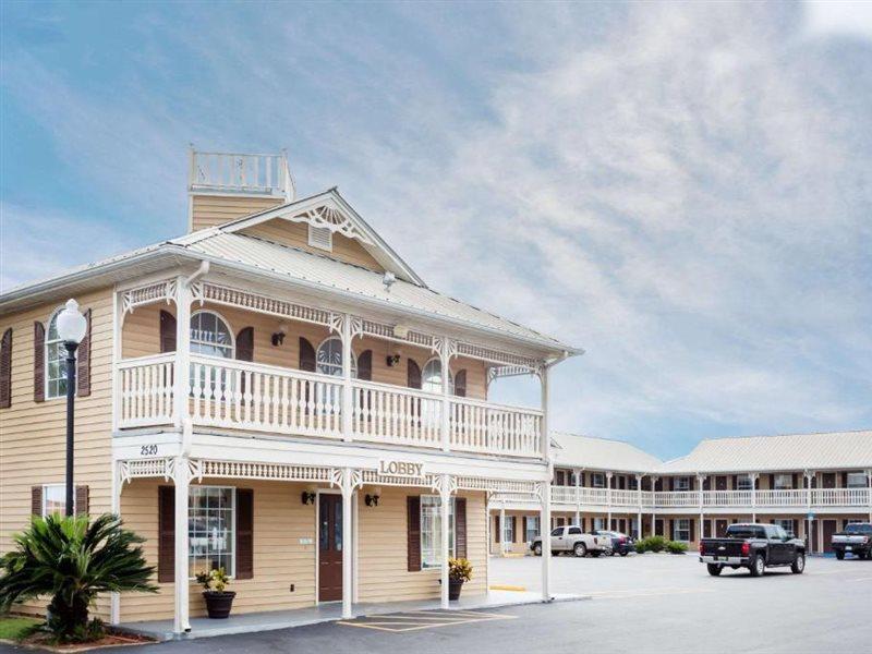 Motel Super 8 By Wyndham Foley Exterior foto